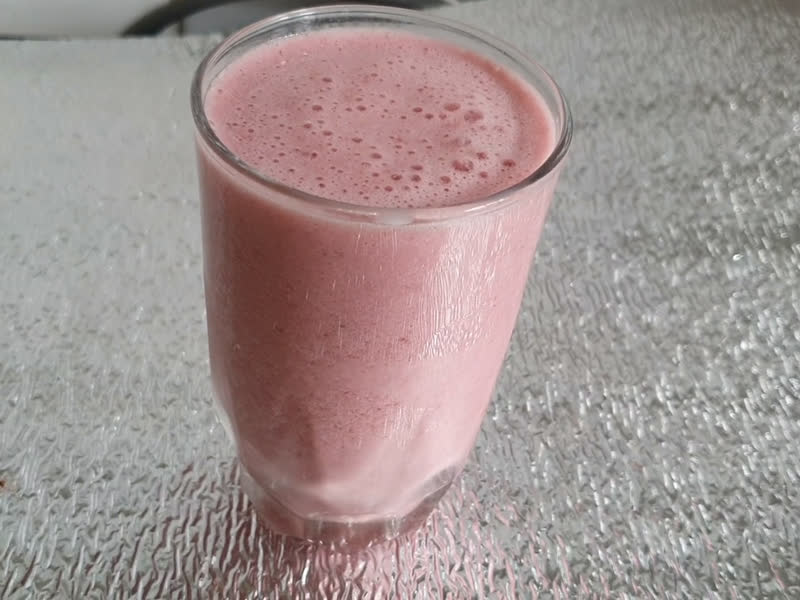 Pink strawberry drink in a glass
